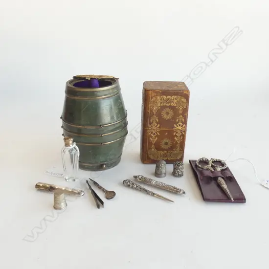 Two leather cased etui / ladies companions.